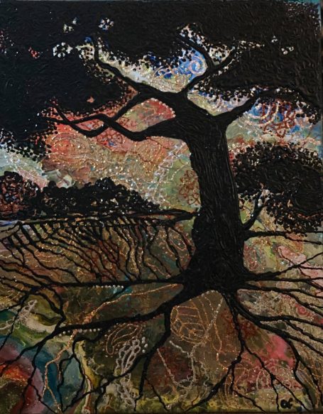 Tree at Sunset Silhouette of a tree on a sunset colored background.